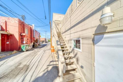 a staircase on the side of a building next to a street at CDA Loft, Minutes from Town in Coeur d'Alene