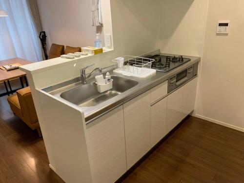 Kuchyň nebo kuchyňský kout v ubytování Maizon de Aile Room D
