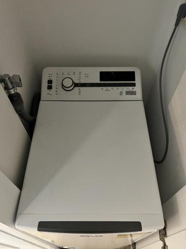 a dvd player sitting on top of a machine at Homevision - Galerius Arch Condo - City Center in Thessaloniki