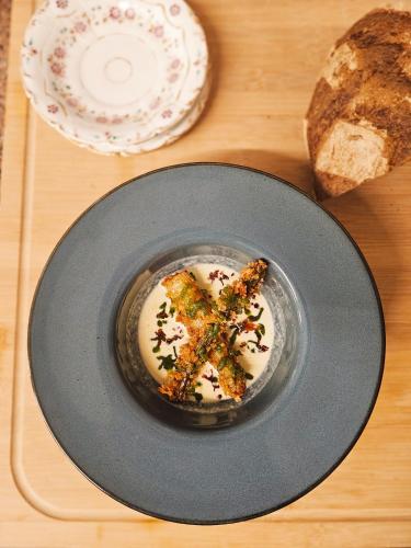 a plate with a piece of food on a table at Auberge de Chanteuges in Chanteuges