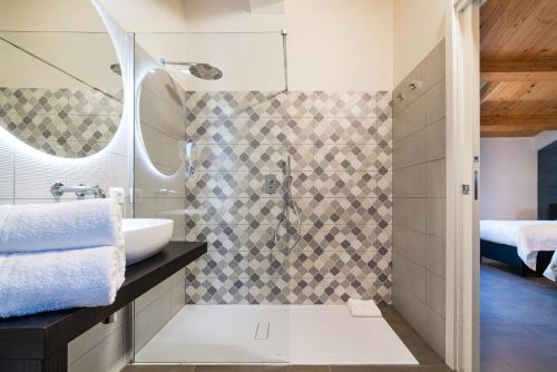 a bathroom with a sink and a shower at I Due Mori - Luxury Rooms in Giardini Naxos