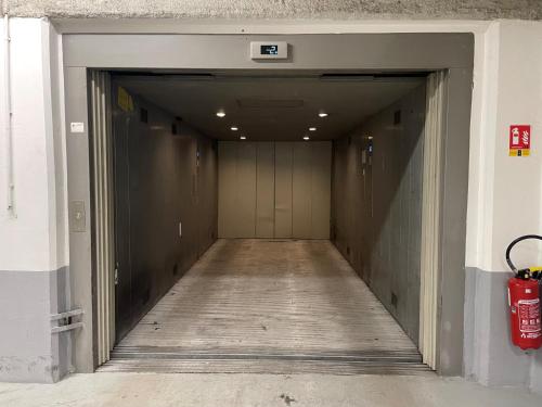 an empty hallway with a door in a building at Le Parisis - Paris Tour Eiffel in Paris