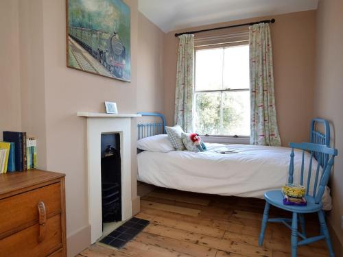 a small bedroom with a bed and a window at 5 bed property in Hastings Sussex 57217 in Hollington