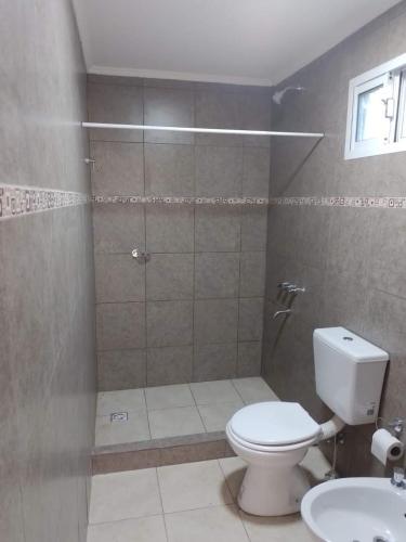 a bathroom with a shower and a toilet and a sink at Timo Fishing in Victoria
