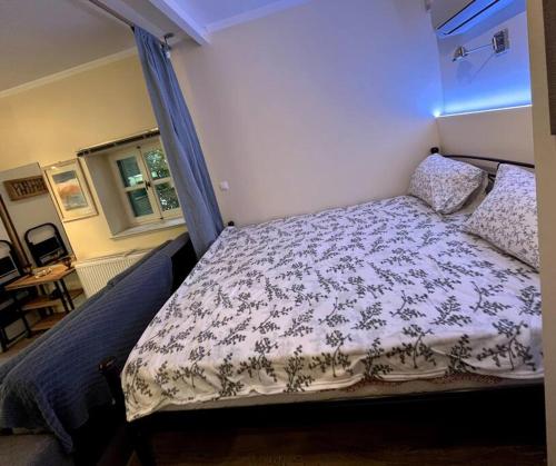 A bed or beds in a room at Orpheus Guesthouse