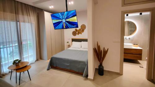 a bedroom with a bed and a bathroom at Elpis' cozy & luxury apartment in Athens