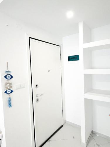 a corridor with a door in a room at Studio by the sea Perea in Perea