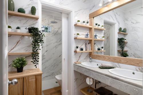 a bathroom with a sink and a mirror at Casa La Rosa Del Mar in Costa Teguise