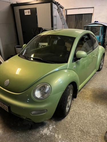 a small green car parked in a garage at Toarp bbp in Oxie