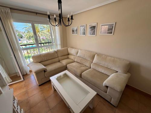 a living room with a couch and a table at Aquamarina - Serviden in Denia