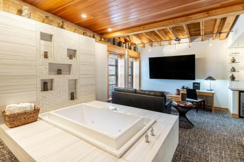 a large bathroom with a large tub in a room at Hotel Donaldson in Fargo