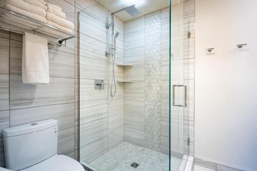 a bathroom with a shower and a toilet at Hotel Donaldson in Fargo