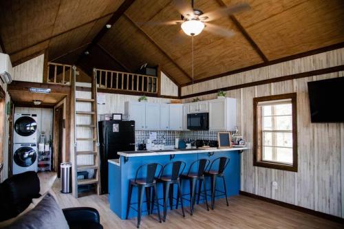 a kitchen with a blue island in a house at Lucky Lodge ViP Cabin Lake Guntersville Pet Friendly Fully Fenced Boat Parking Private in Guntersville