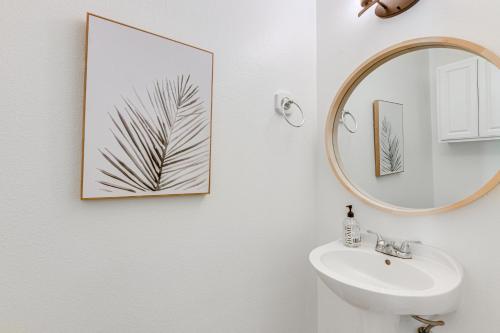 a bathroom with a mirror and a sink at Corpus Christi Condo with Community Pool, Near Beach in Padre Island