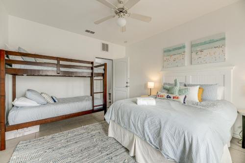 a bedroom with two beds and a ceiling fan at Corpus Christi Condo with Community Pool, Near Beach in Padre Island