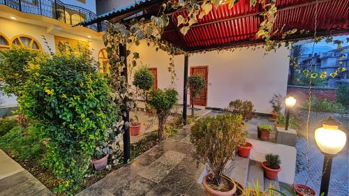 a courtyard with potted plants in a building at Surya International Hotel Manali near Mall Road in Manāli