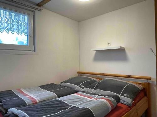 Katil atau katil-katil dalam bilik di Hon70pj kleines Ferienhaus in Ouddorp