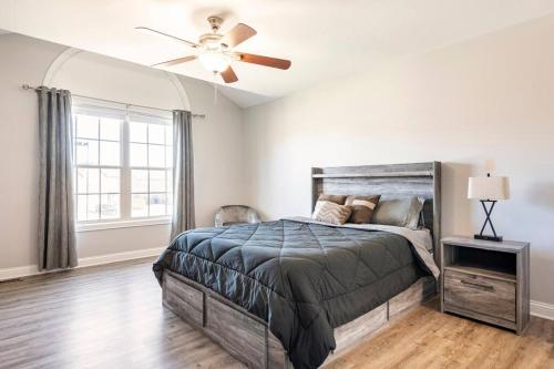 a bedroom with a bed and a ceiling fan at TWO-STORY Townhouse Kentucky Horse Park at Kittens Joy in Lexington