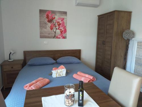 a bedroom with a bed with two hot dogs on it at Monte studio app 3 in Umag