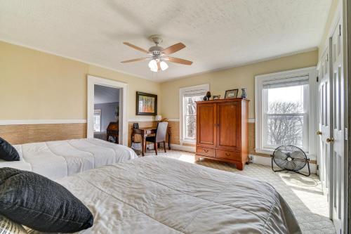 a bedroom with two beds and a ceiling fan at Lakefront Cayuga Retreat with Private Deck and Hot Tub in Cayuga