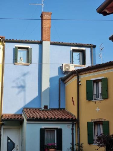 a group of buildings with windows and roofs at Al mare da Iva in Duna Verde