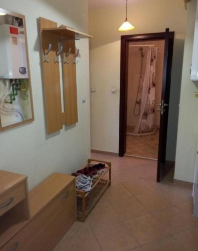 a room with a bathroom with a sink and a mirror at Guestapartvilale in Plovdiv