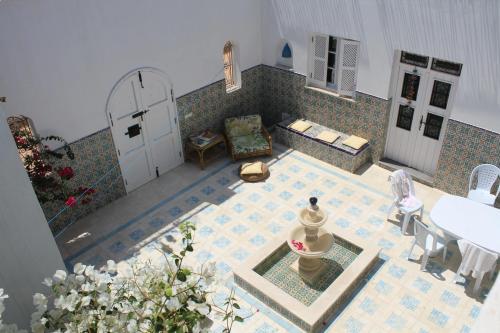 an aerial view of a courtyard with a white door at Spacious villa with private pool in Djerba in Houmt Souk