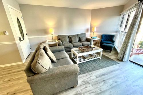 a living room with a couch and a table at Gulfside Townhome 13 Townhouse in Gulf Shores