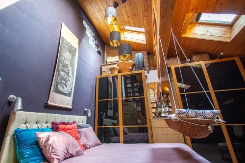 a room with a couch in a room with wooden walls at Art Villa Bucharest in Bucharest