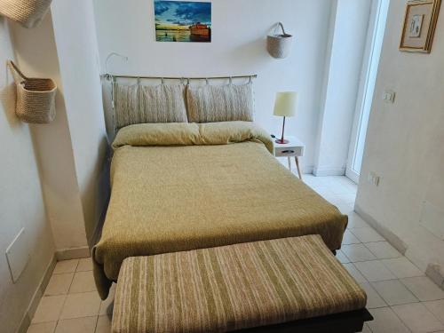 Postel nebo postele na pokoji v ubytování La Tavernetta Little holiday house