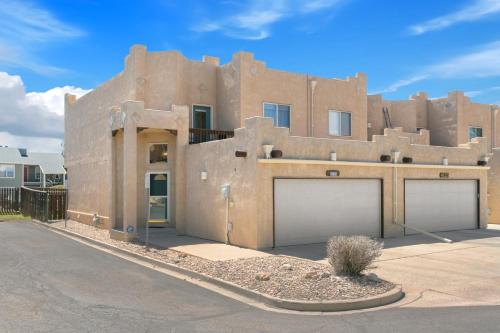 a building with two garage doors in front of it at Executive Townhouse To Stay in Colorado Springs