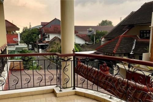 a balcony with a view of a city at homestay kenari pusat kota in Demangan