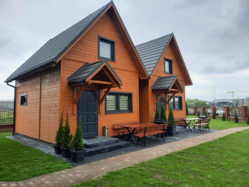 a house with a picnic table in front of it at Energy4YOU Zator in Zator