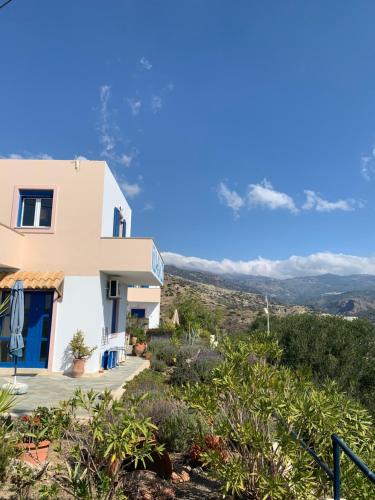 a house with a view of the mountains at Villa Aliki in Myrtos