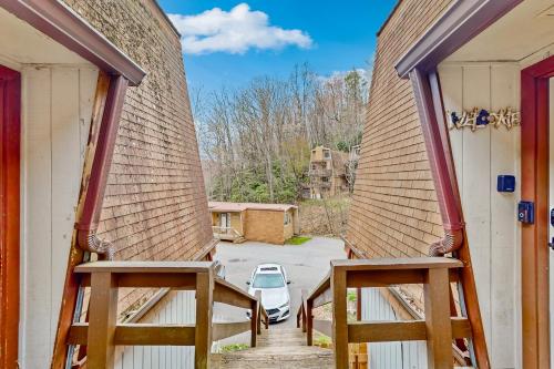 a view from the back of a house with two large doors at 30A Creekside in Banner Elk