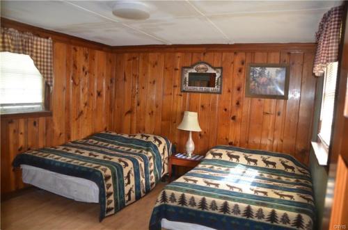 Postel nebo postele na pokoji v ubytování The Lakeside Lodge