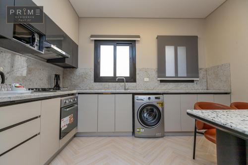 Prime Residence Point 90にあるキッチンまたは簡易キッチン