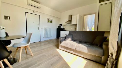 a living room with a couch and a table at Suite649 Nuova 5 in Modena
