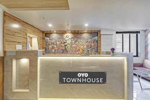 a view of a museum with a painting on the wall at Townhouse Vandana Residency in Ambernath