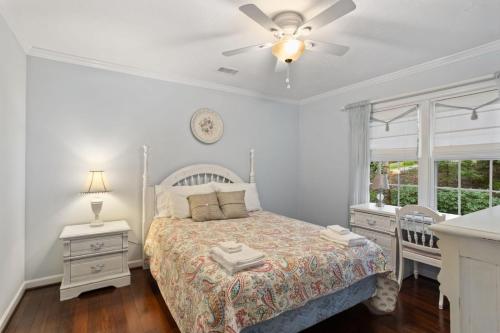 a bedroom with a bed and a ceiling fan at Bella Di Lago in Wilkesboro