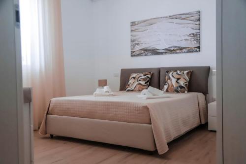 Postel nebo postele na pokoji v ubytování Casa Vacanze Menamè