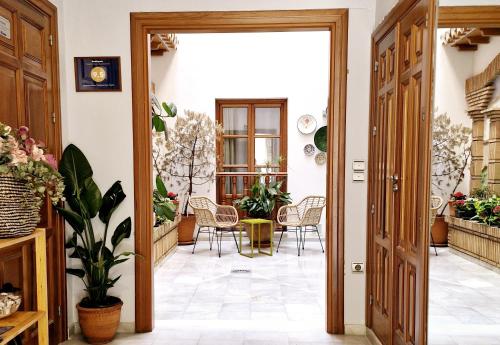 an open door to a patio with a table and chairs at Apartamentos VITA CENTER in Granada