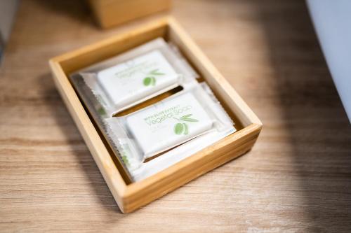 a wooden box with two boxes of soap at Alice&Leo's near METRO M1 RED parking gratis METRO LINE IN 14 MIN FOR CATHEDRAL in Sesto San Giovanni