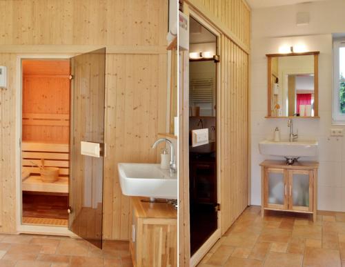 a bathroom with two sinks and a shower at Villa Butterblume in Zinnowitz