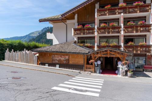 a building on the side of a street at Hôtel Macchi Restaurant & Spa in Châtel