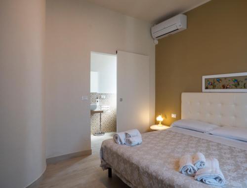 a bedroom with a bed with towels on it at Da Mariolino in Numana