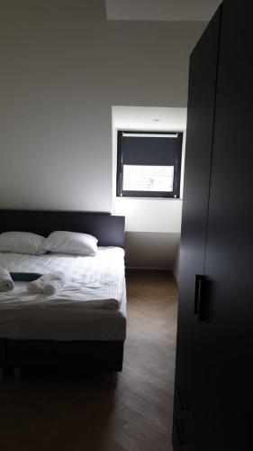 Een bed of bedden in een kamer bij Luxe-Studio J