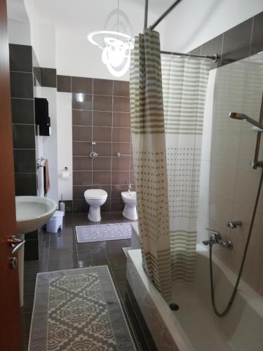 a bathroom with a shower and a sink and a toilet at Passione mare in Trapani