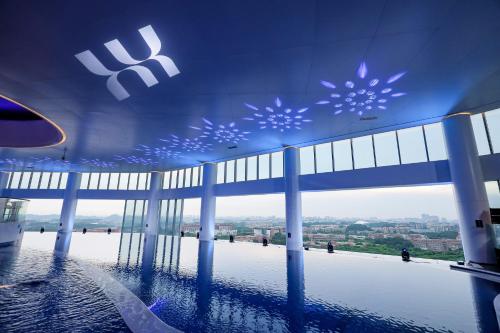 a view of a building with snowstals on the ceiling at Vignette Collection The Xanadu Guangzhou, an IHG Hotel - -Free Canton Fair Shuttle Bus and Registration Counter in Guangzhou