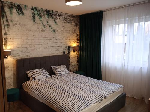 Llit o llits en una habitació de Kolobrzeg Dom w Grzybowo
